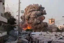 A wide view of Gaza City with damaged buildings, humanitarian aid trucks, and symbolic peace imagery such as a white dove or ceasefire negotiations. (Use a neutral, non-graphic image.)