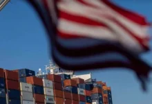 Shipping containers at a U.S. port following the implementation of new import tariffs on goods from nearly 60 countries.