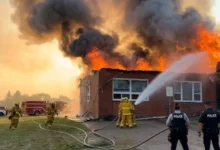 Firefighters battle a massive blaze at the RCMP police detachment in Morse, Saskatchewan, as flames engulf the building during an evening fire.