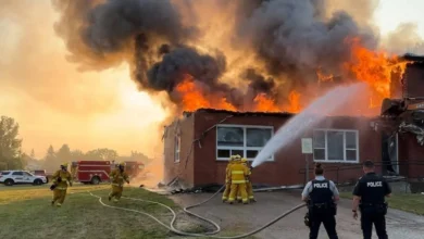 Firefighters battle a massive blaze at the RCMP police detachment in Morse, Saskatchewan, as flames engulf the building during an evening fire.