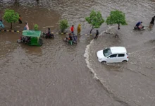 Heavy monsoon rainfall flooding streets in Lahore, Pakistan.