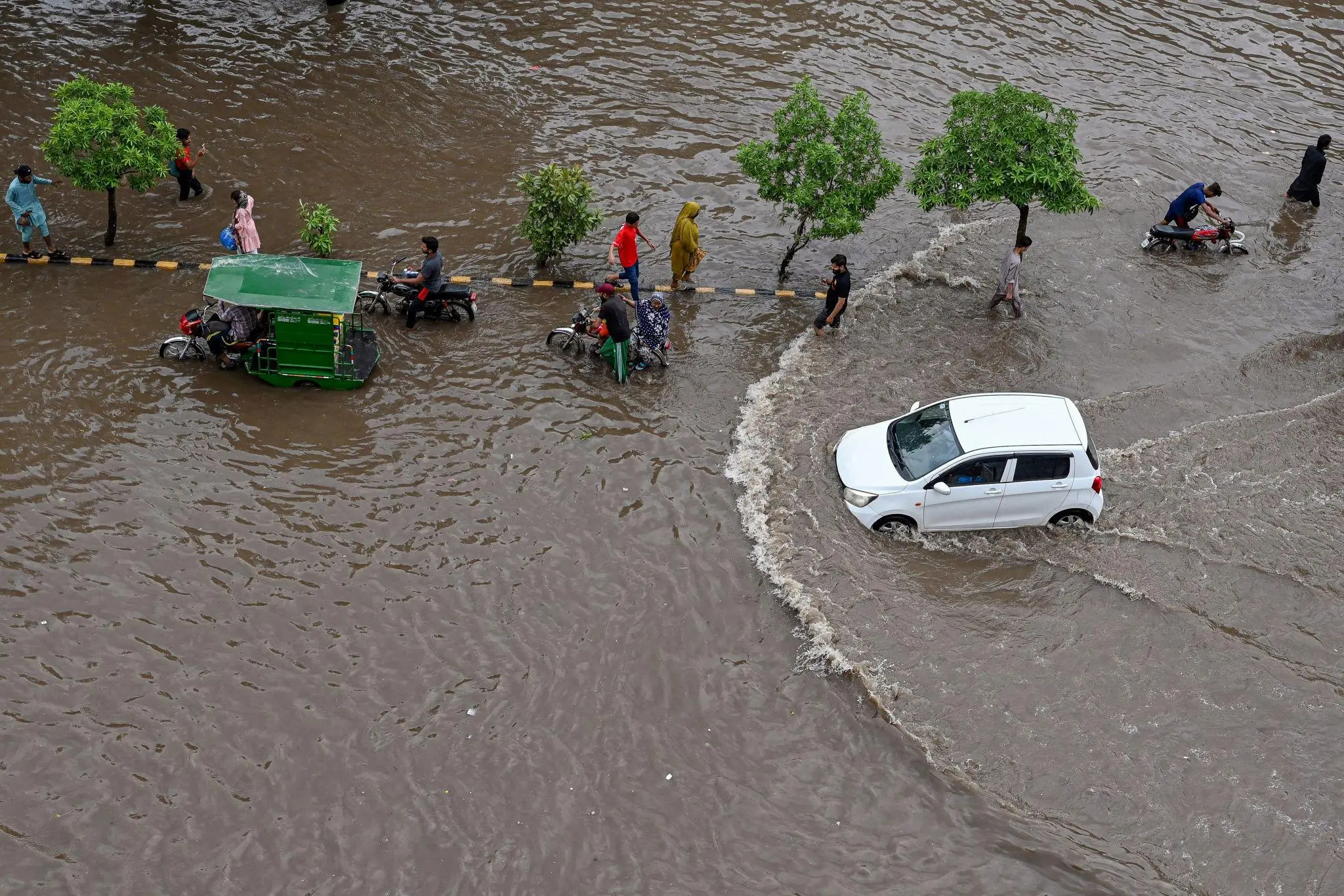 Heavy monsoon rainfall flooding streets in Lahore, Pakistan.
