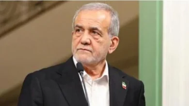 Iranian President Masoud Pezeshkian addressing a national event while emphasizing peace and Iran's commitment to defending its borders.