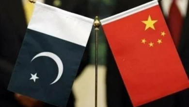 Pakistan and China national flags representing discussions on a $1.3 billion loan refinancing agreement to support Pakistan's foreign exchange reserves.
