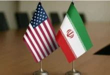 Commercial oil tankers sailing through the Strait of Hormuz amid reported diplomatic talks between the United States, Iran, and Oman