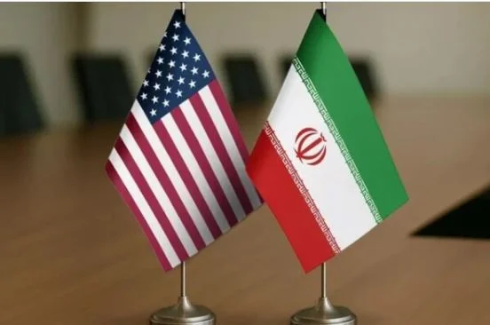 Commercial oil tankers sailing through the Strait of Hormuz amid reported diplomatic talks between the United States, Iran, and Oman