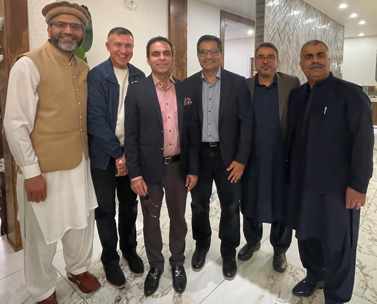 Qasim Ali Shah addressing the Pakistani community at an Al Mustafa Welfare Alberta event in Calgary