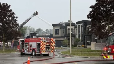 Residential homes damaged in an alleged arson incident in Ajax, Ontario, that led to 11 charges against a 24-year-old man.