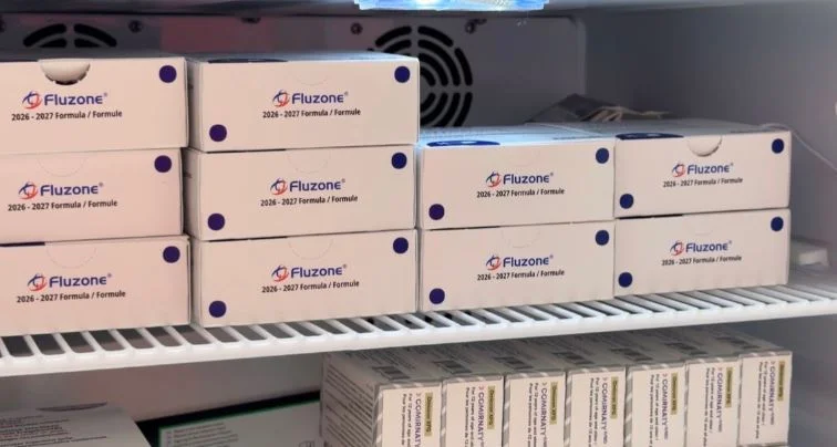 Boxes of flu vaccines displayed on pharmacy shelves ahead of Alberta’s seasonal flu vaccination campaign.