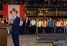 Canadian Prime Minister Mark Carney speaking at an event amid economic challenges involving US tariffs, federal deficits and economic growth.