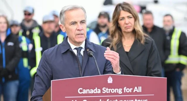 Canadian Prime Minister Mark Carney speaking alongside Alberta Premier Danielle Smith during discussions over Alberta’s relationship with Canada.